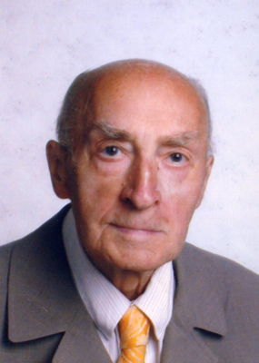 Walter Gottsbachner Ein älterer Herr mit Anzug und gelber Krawatte lächelt leicht in die Kamera.