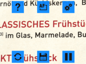 Ein vergrößerter Teil einer Frühstücksspeisekarte mit verschiedenen Symbolen zum ändern des Bilds