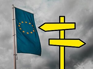 Flagge der EU, daneben ein Wegweiser, der in verschiedene Richtungen zeigt. 